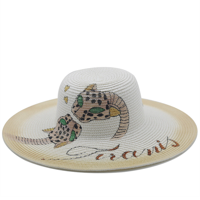 Femmes peignant des chapeaux de paille