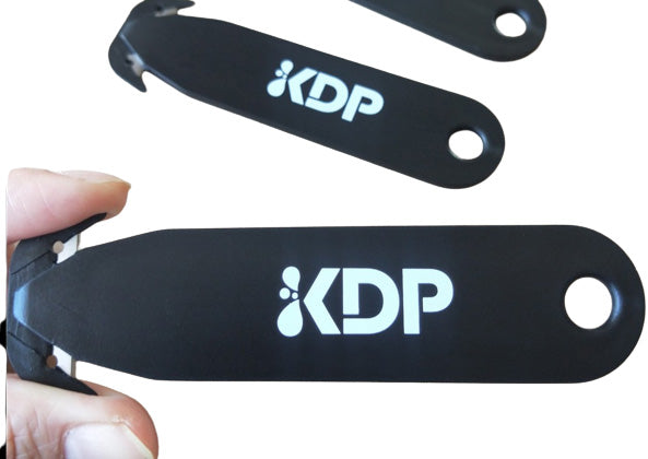 Cutter avec couteau à deux côtés