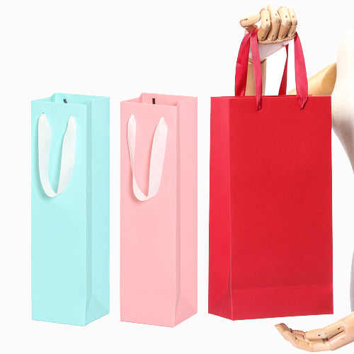 Sac cadeau avec poignée en ruban